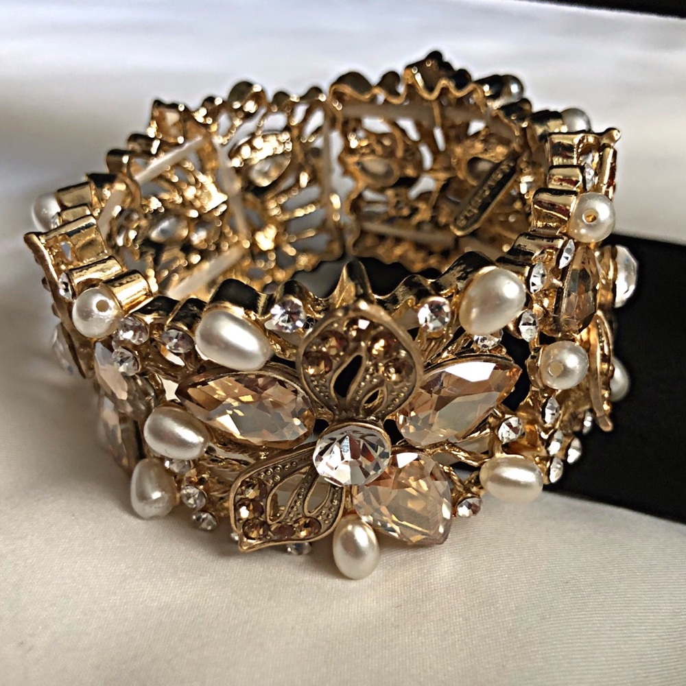 Beautiful gold bracelet with bling and pearls